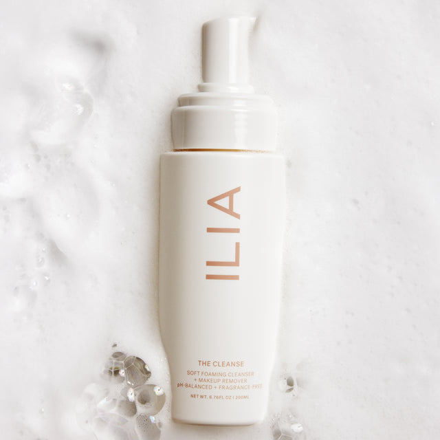 ILIA's the Cleanse in a puddle of foamy cleanser water.